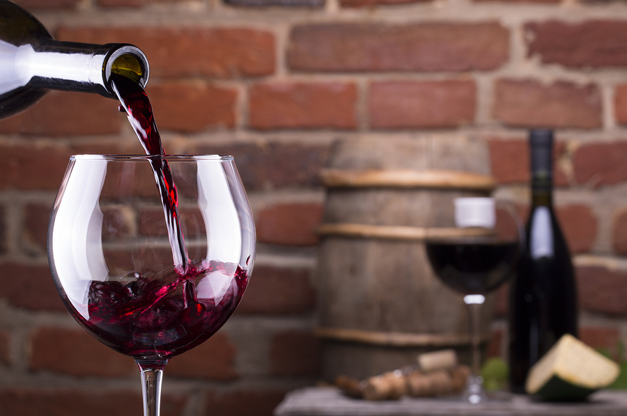 bigstock Glass Of Wine Against A Brick 46934482