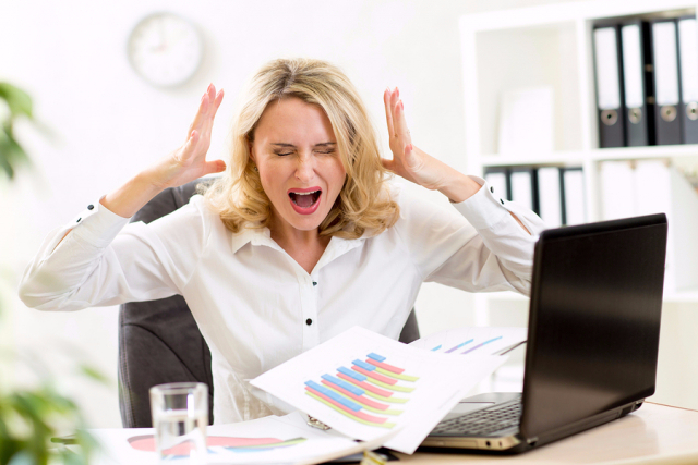 bigstock Stressed businesswoman at lapt 97005800