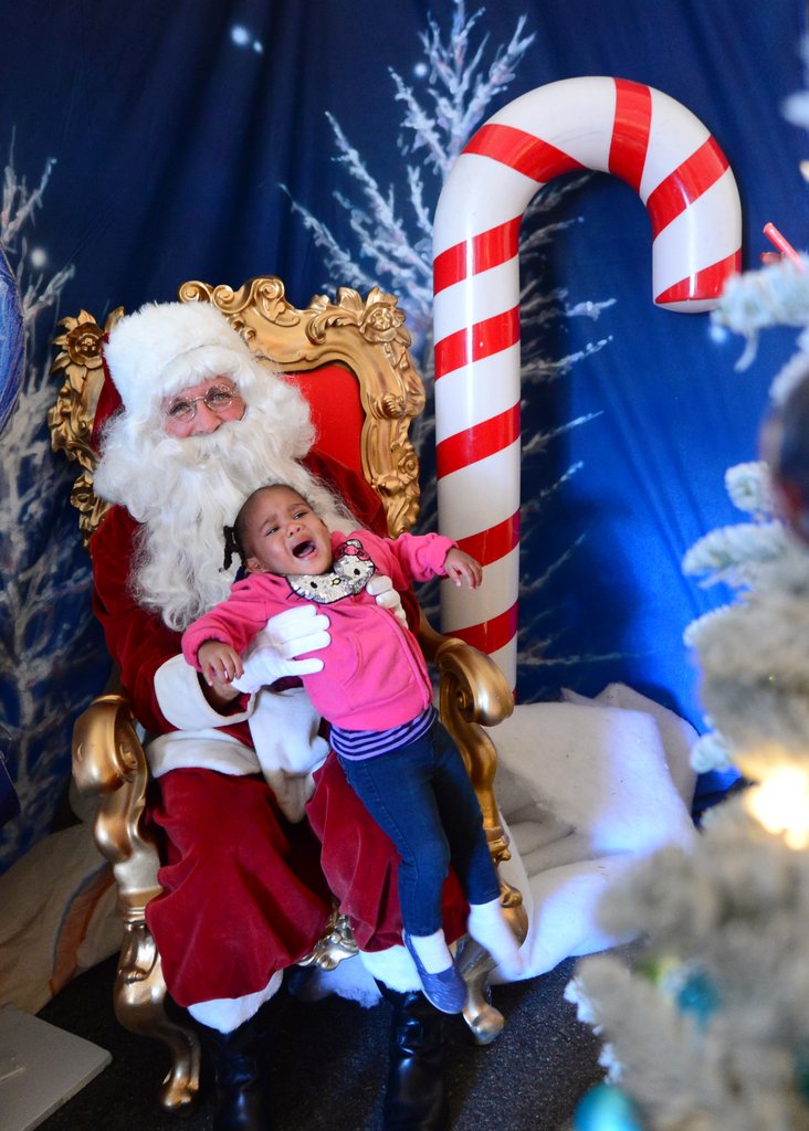 The only thing more terrifying than sitting on Santa's lap is realizing that Santa won't let you run away.  