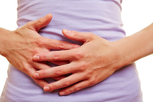 bigstock Woman with stomach ache and pa 129057578