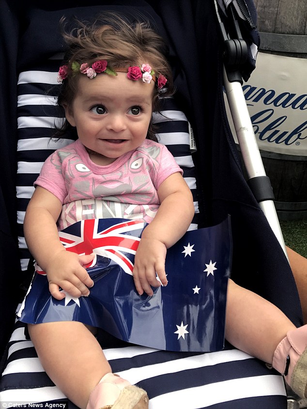 Still only six-months-old, Alexis now has shoulder length hair, looking every bit the surfer Australia is famed for
