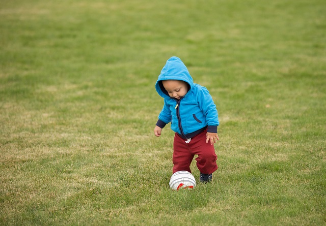 bigstock Baby Playing With Ball 103755557