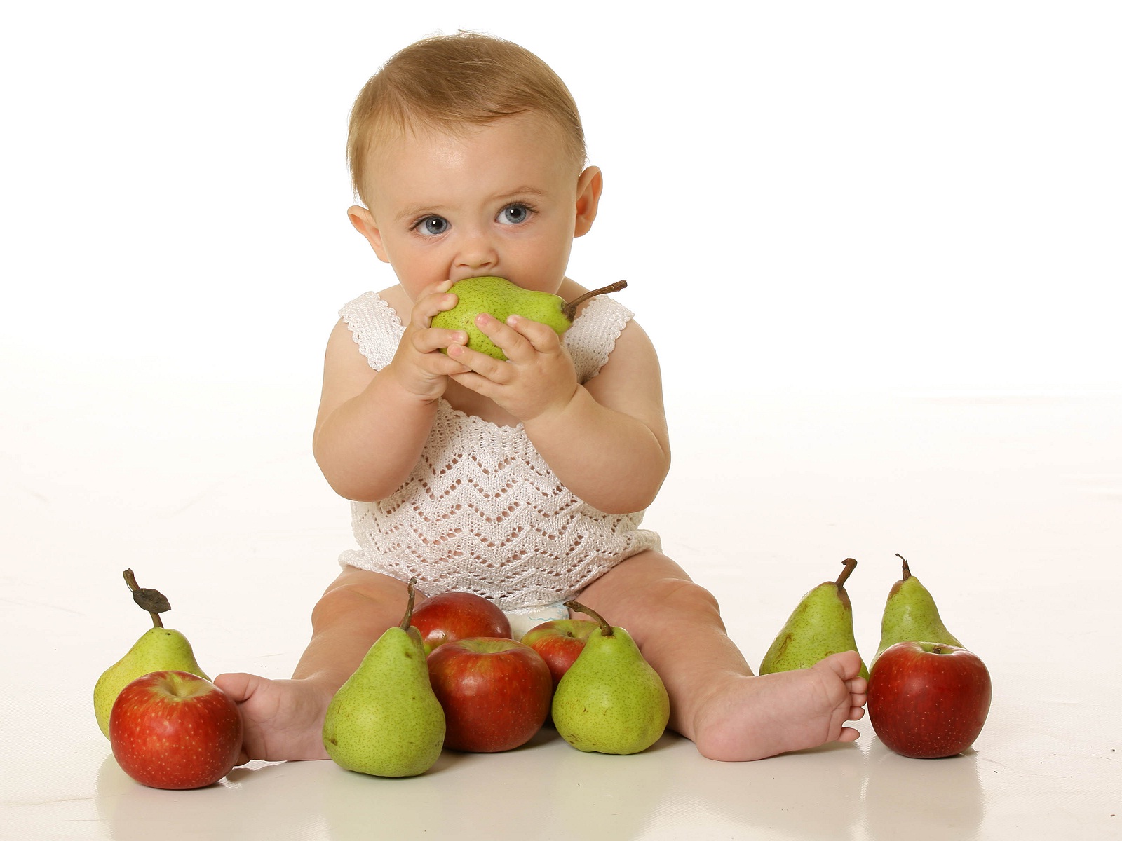 Cute baby eating fruits