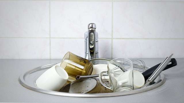 bigstock Many Dirty Dishes In The Kitch 183618067