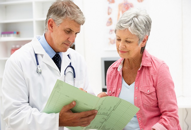 bigstock Doctor with female patient 21258452