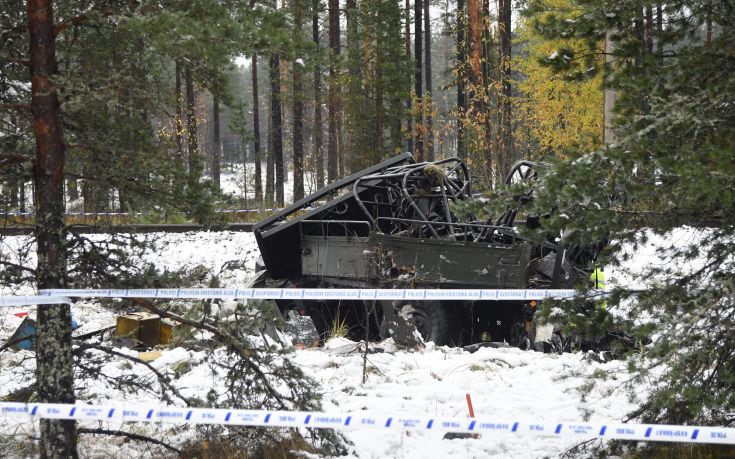 The wreckage of a military truck lays by the side of the railway tracks after several people were killed in a crash with a train in southern Finland Thursday Oct. 26, 2017.  Finnish media say several people have been killed in a train crash in the southern part of Finland. (Markku Ulander/Lehtikuva via AP)