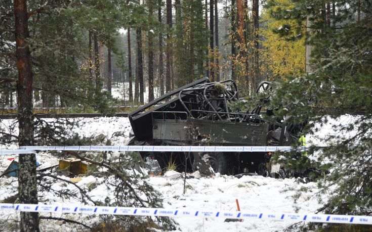 The wreckage of a military truck lays by the side of the railway tracks after several people were killed in a crash with a train in southern Finland Thursday Oct. 26, 2017. Finnish media say several people have been killed in a train crash in the southern part of Finland. (Markku Ulander/Lehtikuva via AP)