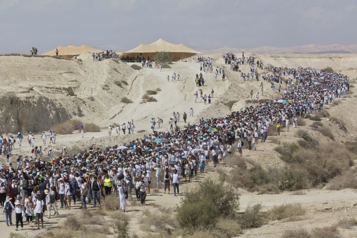 Israeli and Palestinian women participate in a march organized by the "Women Wage Peace" organization, near the Dead Sea, Sunday, Oct. 8, 2017. Thousands of women are wrapping up the march around the region, demanding that their leaders act to achieve a peace agreement. “The group says the two-week march sends a message to their leaders to work toward a negotiated solution to the Israeli-Palestinian conflict and to make sure women have equal representation in any talks. (AP Photo/Sebastian Scheiner)