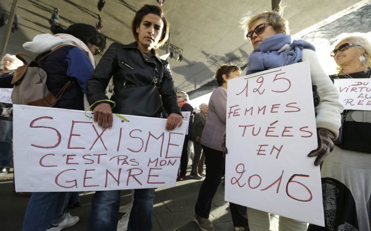 Demonstrators hold placards reading "Sexism, that is not my gender“ and “125 women killed in 2016", right, during a demonstration in Marseille, southern France, Sunday, Oct. 29, 2017. French women are protesting sexual abuse and harassment in 11 cities across the country under the #MeToo banner in the wake of mounting allegations against Hollywood mogul Harvey Weinstein. (AP Photo/Claude Paris)