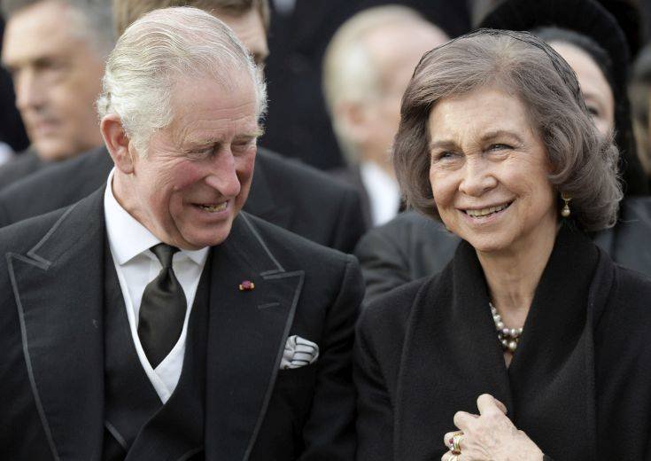Britain's Prince Charles, left, and former Spanish Queen Sofia attend the funeral ceremony in tribute to late Romanian King Michael in Bucharest, Romania, Saturday, Dec. 16, 2017. Tens of thousands of Romanians joined the European royals on Saturday to pay their respects to late King Michael as a state funeral got underway. Michael, who ruled Romania twice before being forced to abdicate by the communists in 1947, died at the age of 96 in Switzerland this month. (AP Photo/Andreea Alexandru)