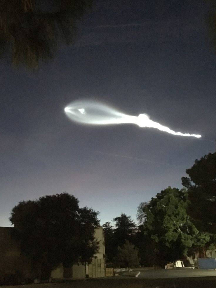 The contrail from a SpaceX Falcon 9 rocket is seen from Burbank, Calif., more than 100 miles southeast from its launch site in Vandenberg Air Force Base, Calif., on Friday, Dec. 22, 2017.  A reused SpaceX rocket carried 10 satellites into orbit from California on Friday, leaving behind a trail of mystery and wonder as it soared into space. The launch in the setting sun created a shining, billowing streak that was widely seen throughout Southern California and as far away as Phoenix. (AP Photo/Jimmy Golen)