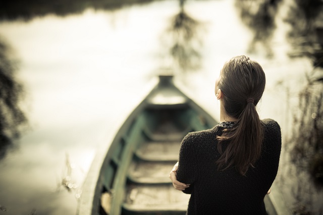 bigstock Girl at the old fishing boat l 118545137