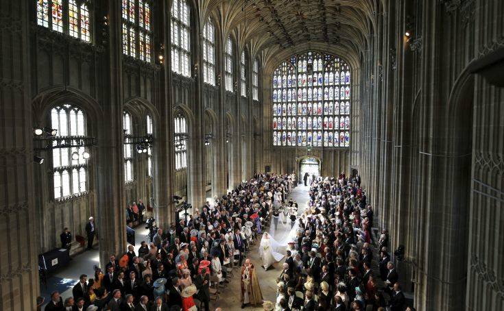 Meghan Markle and her bridal walk down the aisle at the beginning of the wedding ceremony of Prince Harry and Meghan Markle at St. George's Chapel in Windsor Castle in Windsor, near London, England, Saturday, May 19, 2018. (Danny Lawson/pool photo via AP)