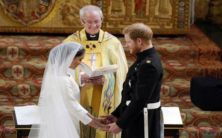 Britain's Prince Harry and Meghan Markle exchange vows during their wedding ceremony at St. George's Chapel in Windsor Castle in Windsor, near London, England, Saturday, May 19, 2018. (Owen Humphreys/pool photo via AP)