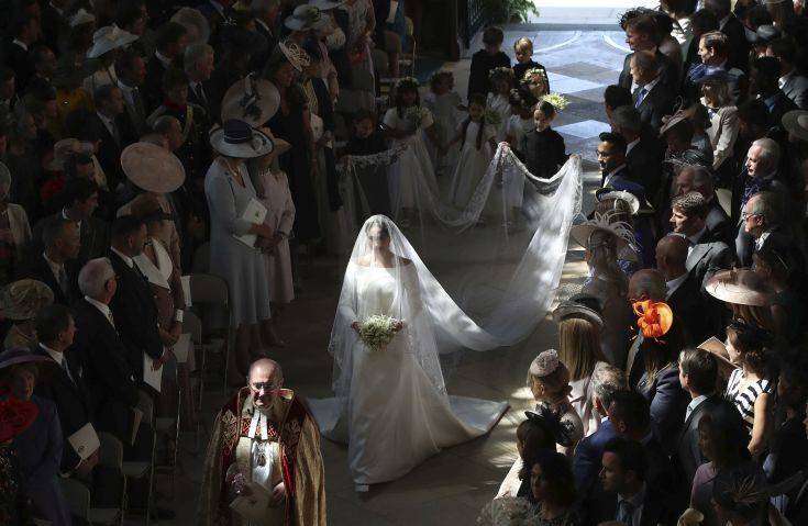 Meghan Markle walks down the aisle as she arrives for the wedding ceremony to Prince Harry at St. George's Chapel in Windsor Castle in Windsor, near London, England, Saturday, May 19, 2018. (Danny Lawson/pool photo via AP)
