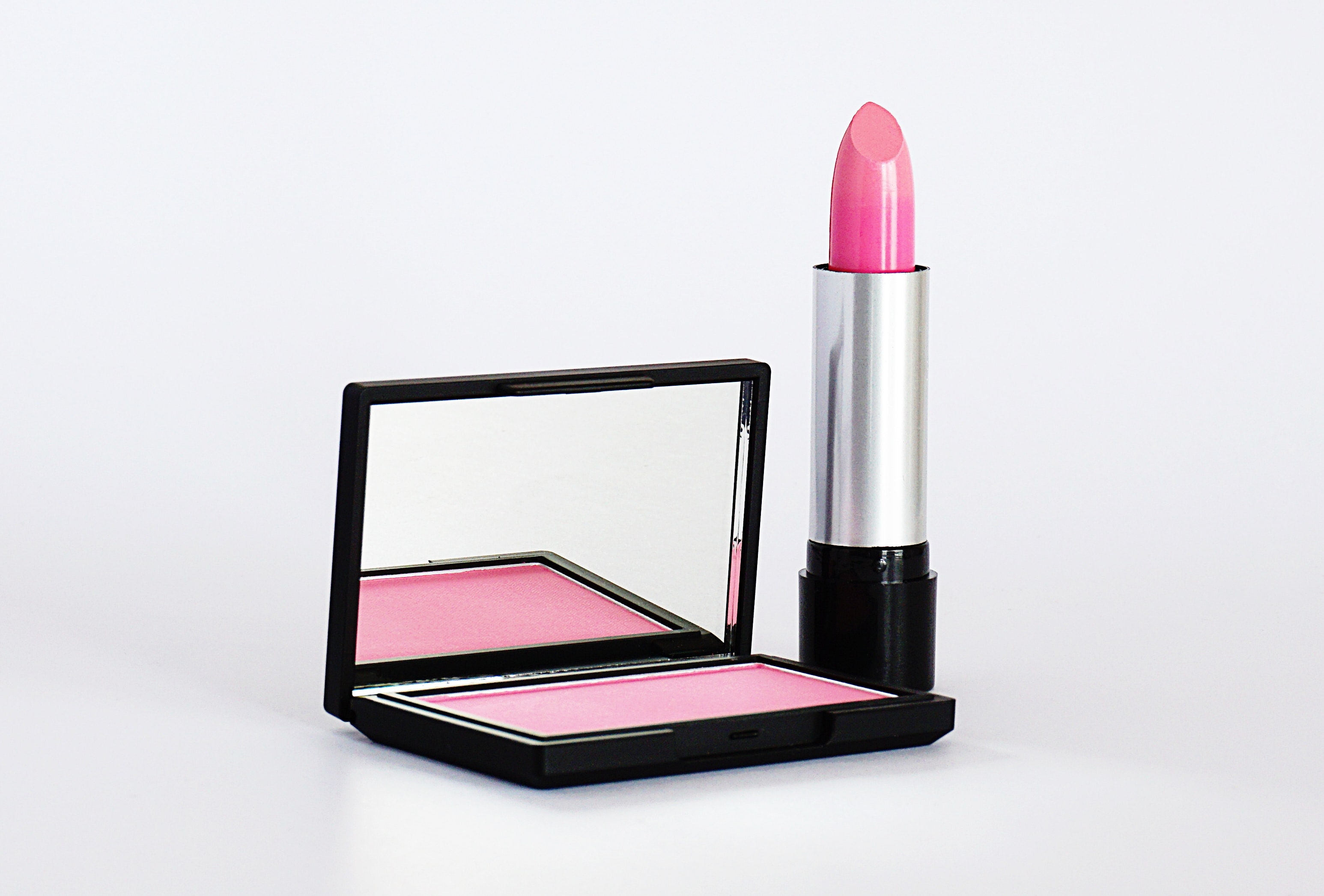 close up photo of pink lipstick and blush on 2533266