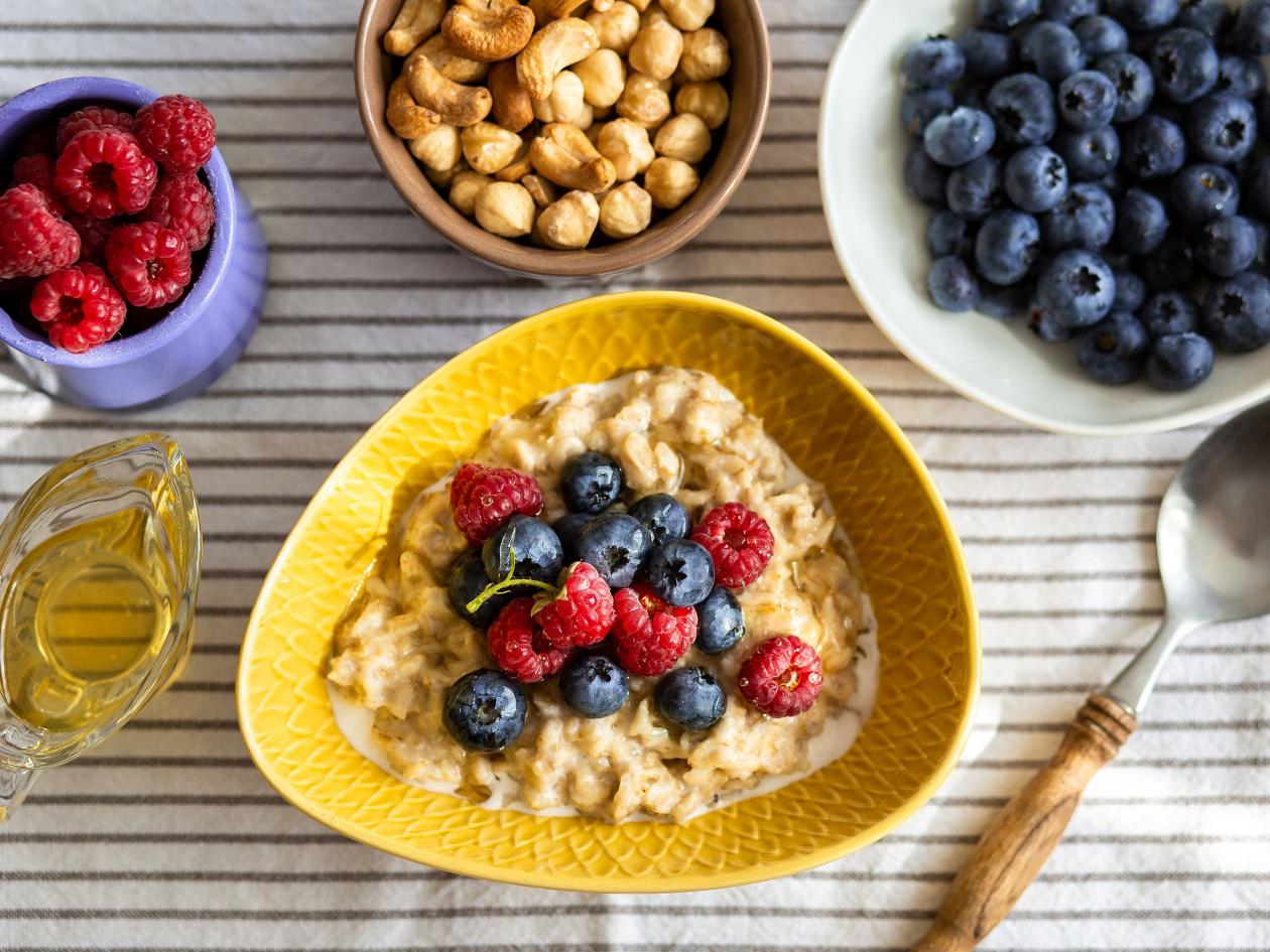 Oatmeal with berries and honey for breakfast.Beautiful healthy breakfast.Proper nutrition of the stu