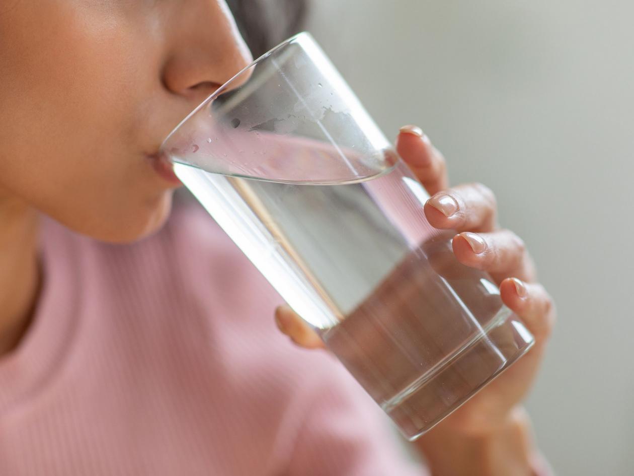 Healthy Liquid. Unrecognizable Young Lady Drinking Clean Mineral Water From Glass At Home, Thirsty B