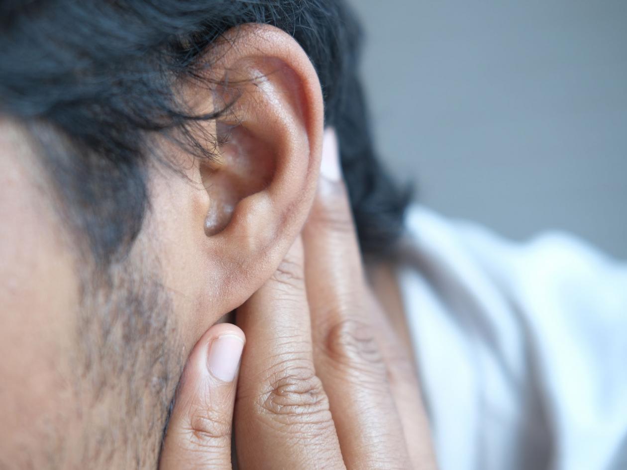 Young Man Having Ear Pain Touching His Painful Ear ,