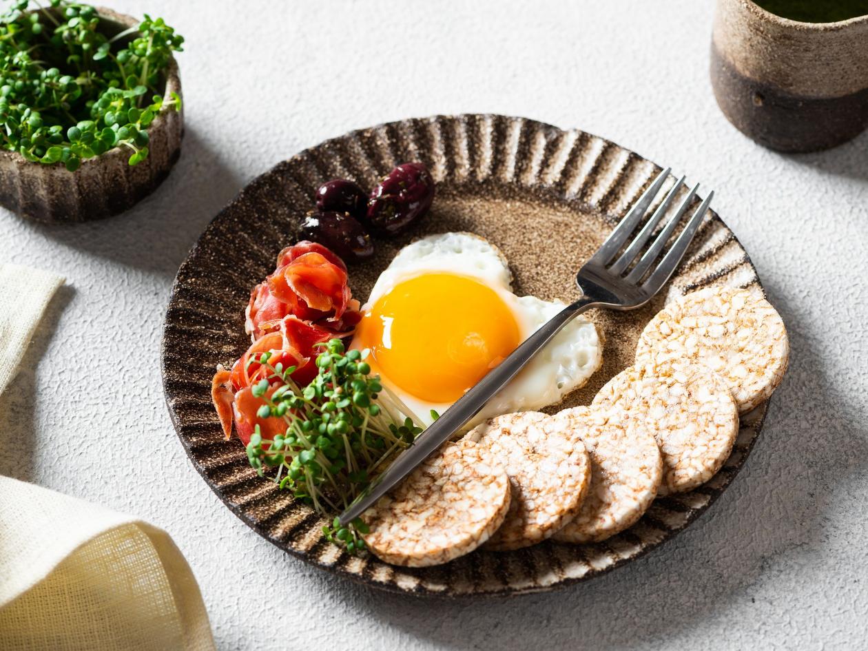 Romantic Breakfast On Women's Day - Fried Eggs In The Shape Of A Heart And Olives. Healthy Breakfast