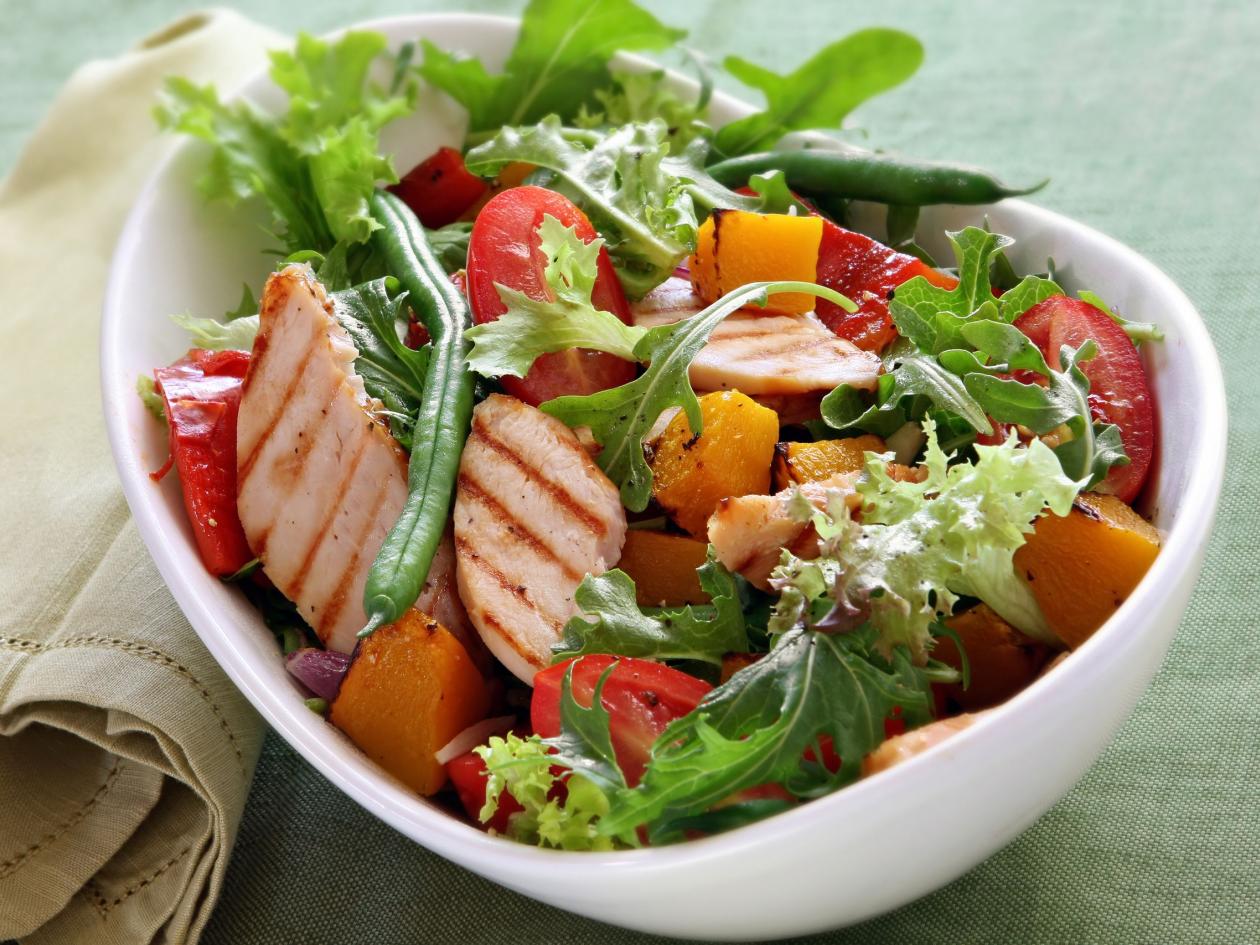 Chicken salad with roasted vegetables and mixed greens. Delicious healthy eating.