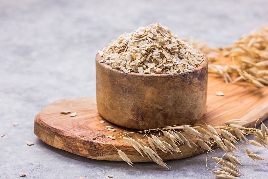 Oat. Oat Flakes. Dry Oat Flakes, Oatmeal On A Wooden Background. Healthy Vegan, Vegetarian Food. Cle