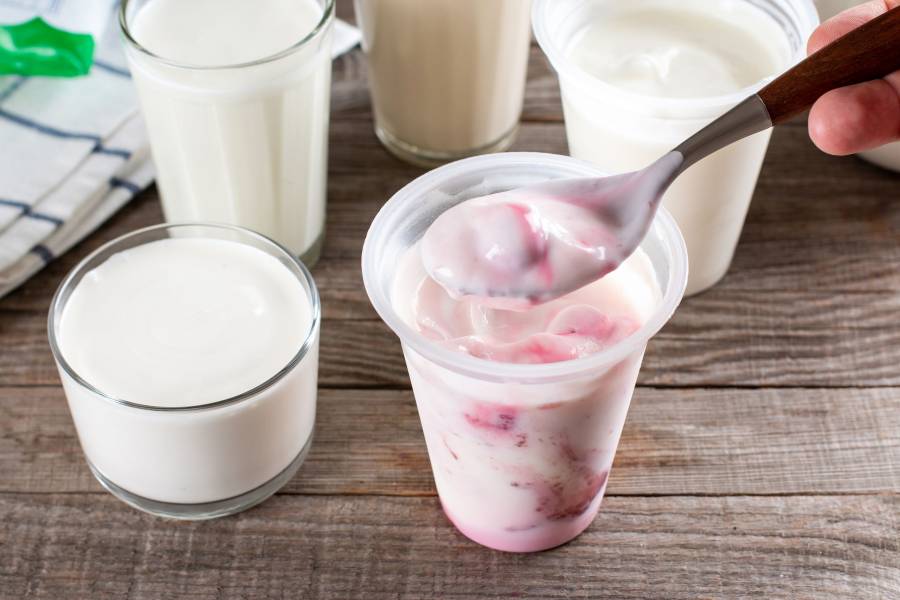 Frozen Yogurt. Frozen Dairy Products On A Wooden Table