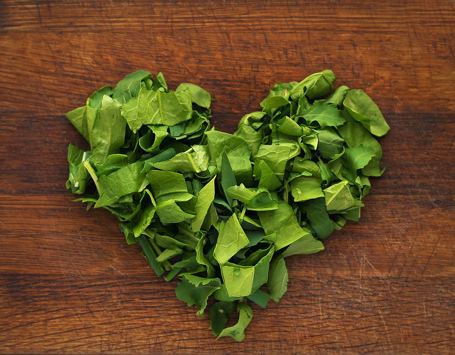 Chopped Spinach In The Form Of A Heart On A Cutting Board